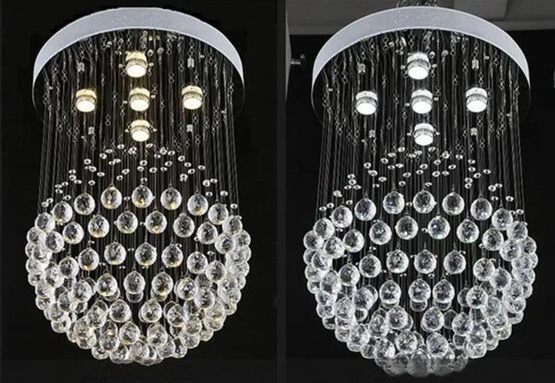 Modern spherical crystal chandelier with polished steel, LED lights, and cascading glass orbs suspended by wires.