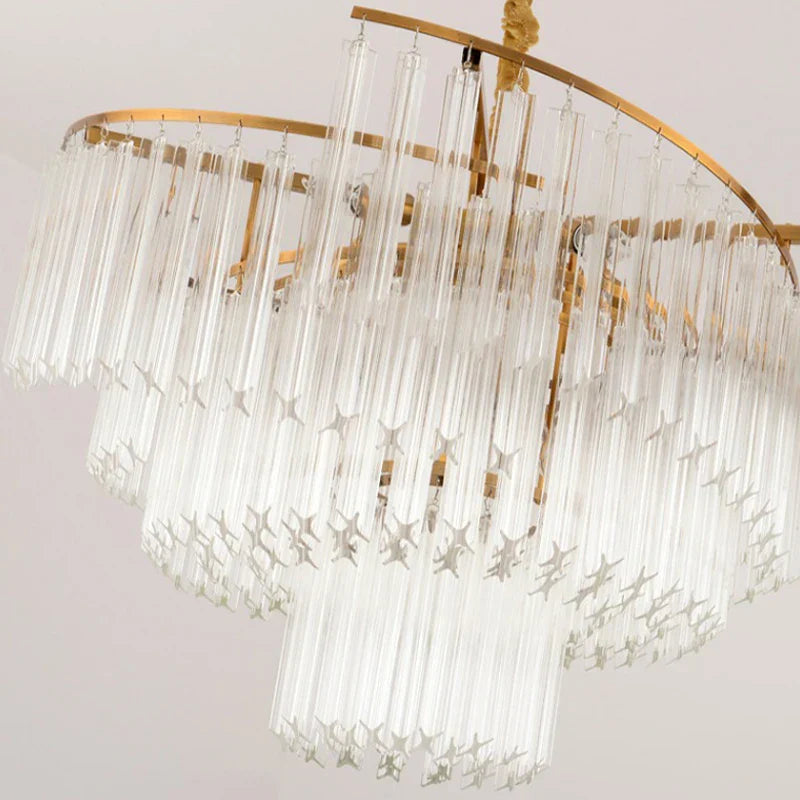 Cascading clear glass rods and gold frame chandelier, elegant modern crystal pendant lighting.
