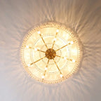 Elegant geometric crystal chandelier with multiple bulbs, featuring sparkling crystal accents and warm light.