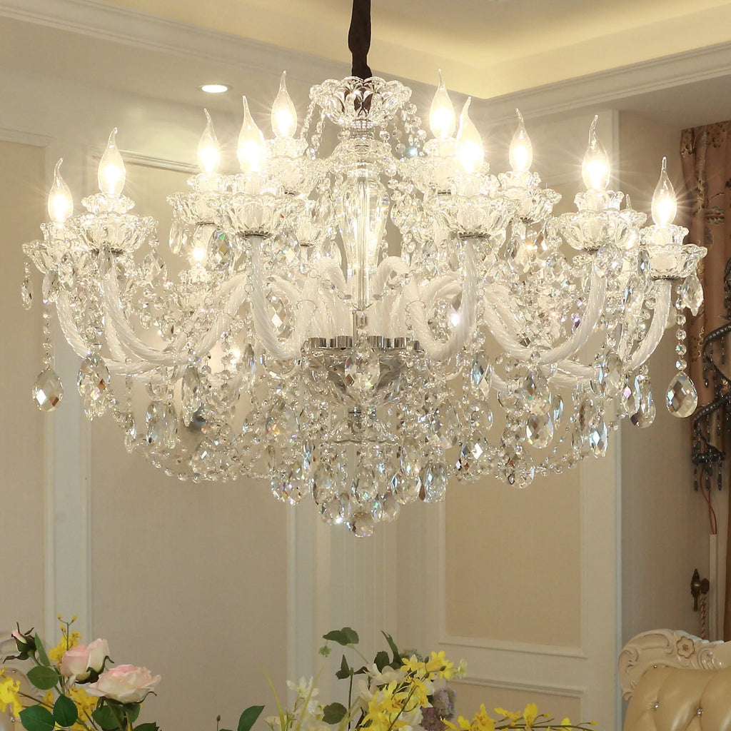 The Maison Ornate Large Crystal Chandelier sparkles from the ceiling with shining, reflective crystals.