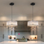Pair of Maison Ornate Elegant Art Deco crystal chandeliers with adjustable lighting, shown suspended.