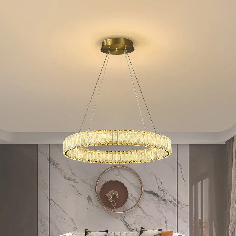 Maison Ornate Modern LED Crystal Hanging Pendant Light features elegant crystals and sleek, contemporary lines.
