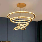 Dimmable modern LED chandelier with intertwined gold rings and crystal accents, elegant statement piece.