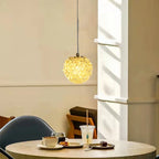 Maison Ornate Modern Crystal Ball Chandelier with Artistic Design, sparkling and radiating a warm glow.