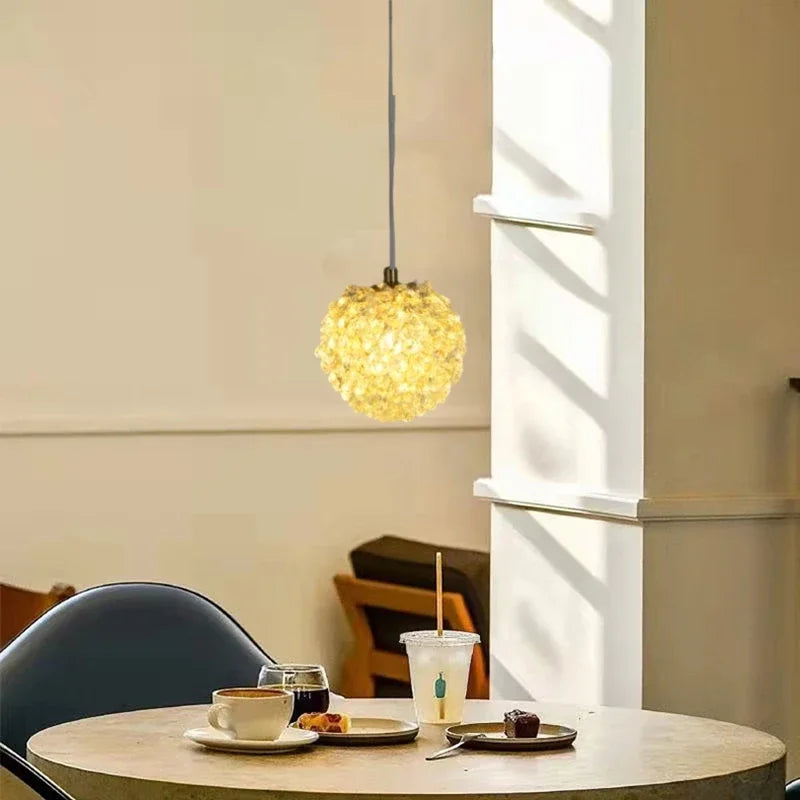 Maison Ornate Modern Crystal Ball Chandelier with Artistic Design, sparkling and radiating a warm glow.