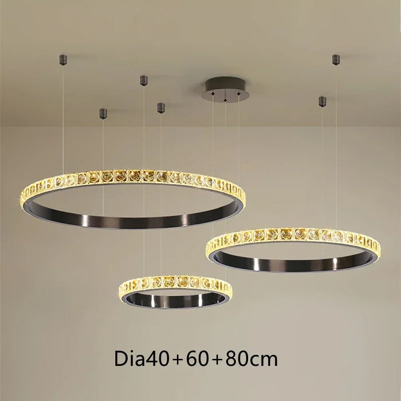 Three Maison Ornate crystal chandeliers with black inner rings and illuminated edges in 40cm, 60cm, 80cm sizes.