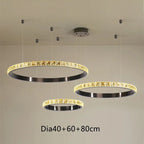 Three Maison Ornate crystal chandeliers with black inner rings and illuminated edges in 40cm, 60cm, 80cm sizes.