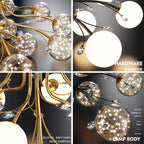 Maison Ornate Crystal Ball Chandeliers with LED stars, clear glass, gold hardware, and black arms.