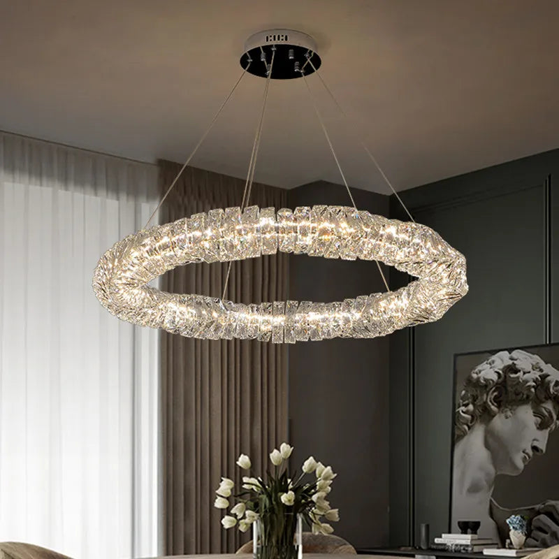 The Maison Ornate K9 Crystal Industrial Chandelier, oval LED design, sparkles with luxurious brilliance.