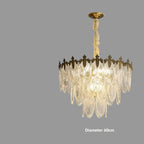 Ornate Art Deco chandelier with gold accents, crystal leaf glass, and warm LED light. "Diameter 60cm" shown.
