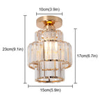 Gold-trimmed Art Deco chandelier with three clear glass tiers, 23cm tall, elegant and modern.