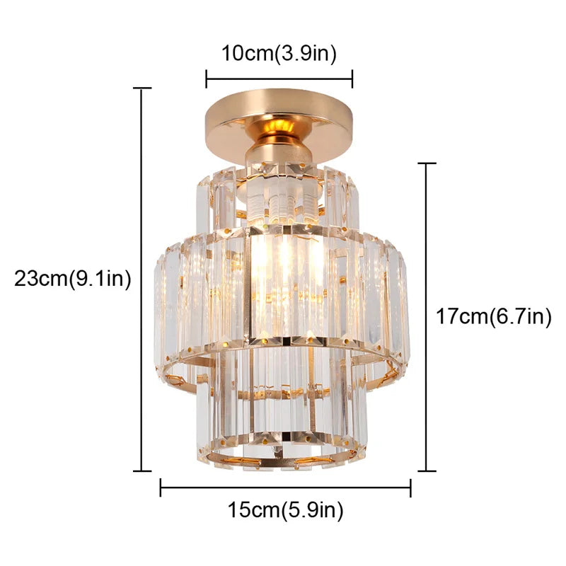 Gold-trimmed Art Deco chandelier with three clear glass tiers, 23cm tall, elegant and modern.