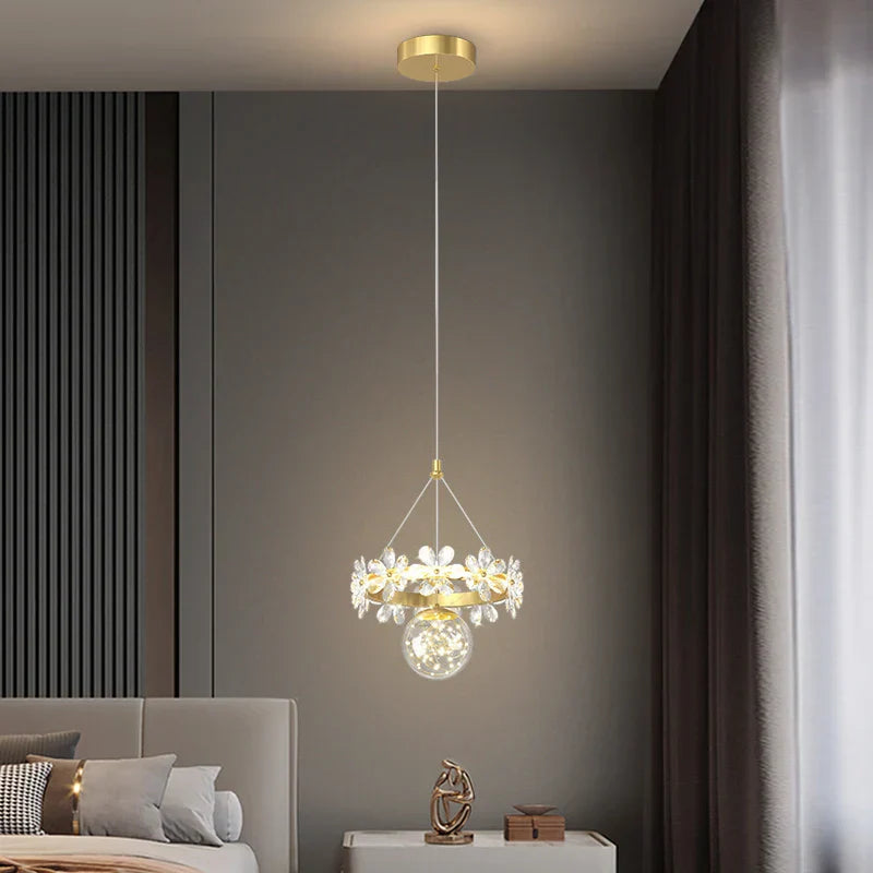Maison Ornate Minimalist Single-Head Crystal Ball Pendant Light with floral designs and luminous bulb.