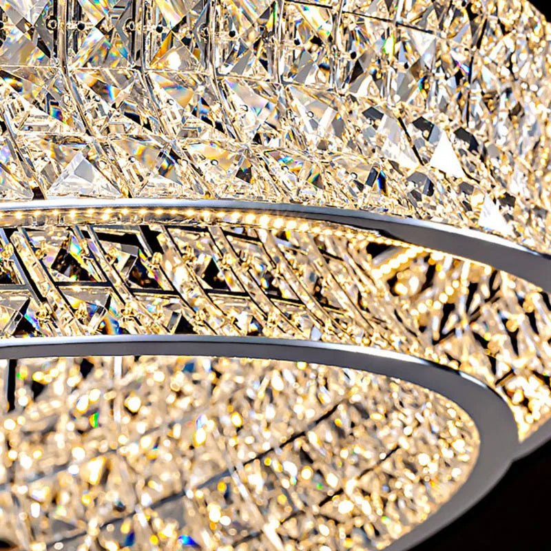 Ornate crystal ball chandelier with stainless steel rings, sparkling crystals, and adjustable hanging cord.