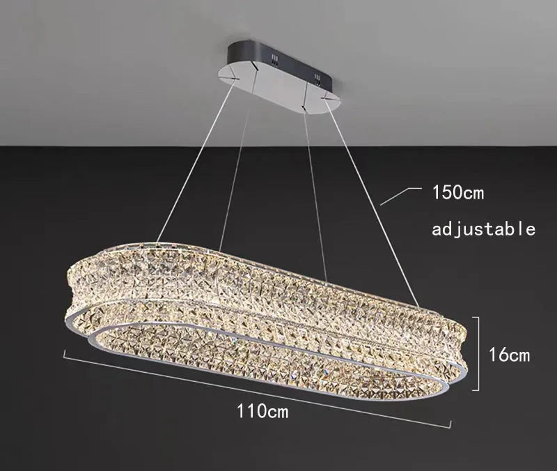 Modern rectangular stainless steel chandelier with two oval crystal layers, 110x16 cm, adjustable cord up to 150 cm.