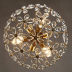 Gold rods and clear crystal petals form a dazzling LED flower chandelier sphere, elegantly dimmable.