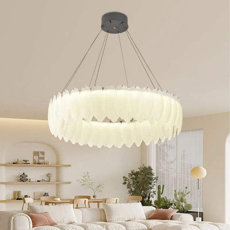 The Maison Ornate Crystal Ball Chandelier with decorative feathers and glass embellishments.