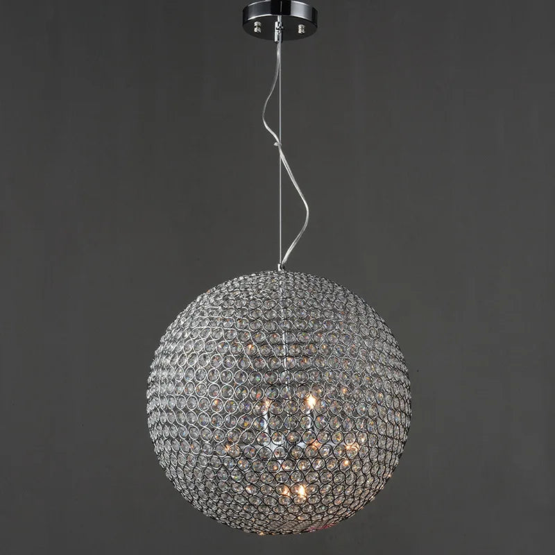 Maison Ornate Round Crystal Ball LED chandelier with glass circle lattice, emitting a warm glow.