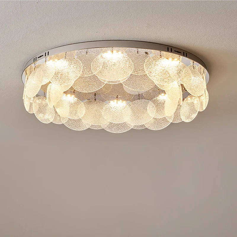 Postmodern crystal chandelier with tiered textured glass panels and warm integrated LED lighting.