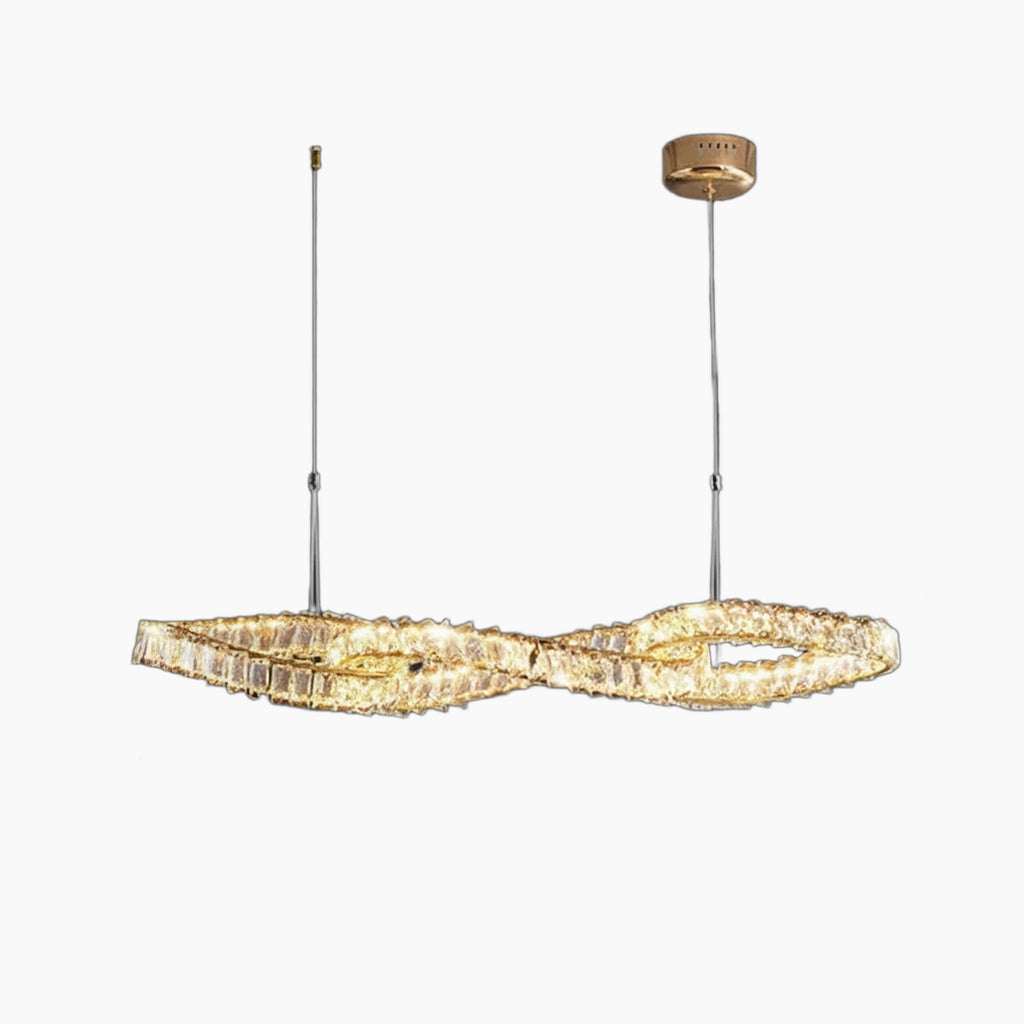Twisted gold and crystal chandelier with modern LEDs, suspended by thin cables from round mount.
