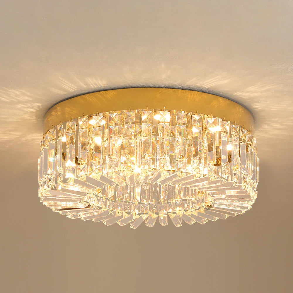 Maison Ornate Modern Gold Crystal Chandelier with LED lighting and prisms for warm, sparkling illumination.