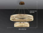 Two gold-tone rings with crystal-like chains form a modern, adjustable luxury chandelier.