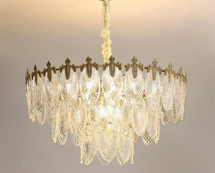 Retro leaf crystal Art Deco chandelier with layered glass leaves and bronze accents, glowing warm LEDs.