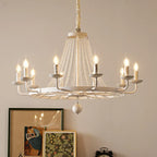 Elegant crystal chandelier with tassels, gold accents, eight candle bulbs, and sparkling crystal beads.
