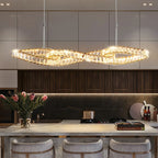 Maison Ornate Elegant Hanging Crystal Chandelier with modern LEDs in a twisted loop shape.
