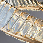 Close-up of Maison Ornate Industrial Crystal Chandelier with faceted prisms reflecting rainbow LED light.
