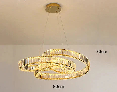 Two intertwined oval LED crystal rings create a warm, elegant chandelier for modern spaces.