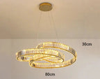 Two intertwined oval LED crystal rings create a warm, elegant chandelier for modern spaces.