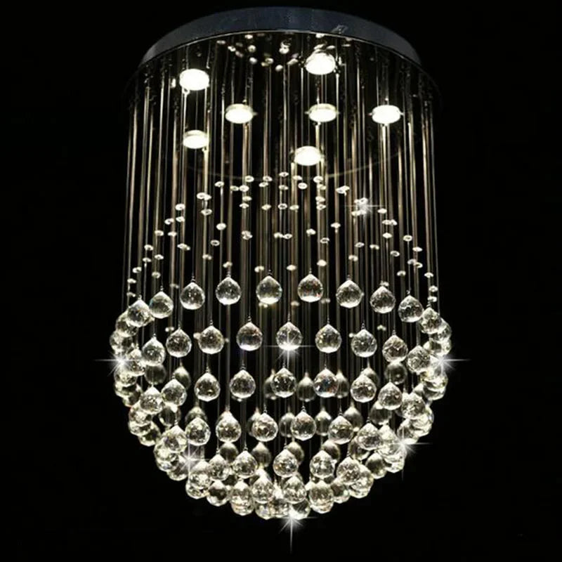 Polished steel chandelier with LED-lit crystal droplets suspended from thin wires, modern and sparkling.