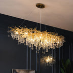 Maison Ornate Crystal Chandelier with gold branches and glass droplets, suspended elegantly from wires.