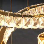 Rectangular faceted crystals on metal rings form a sparkling, elegant Nordic Design chandelier.