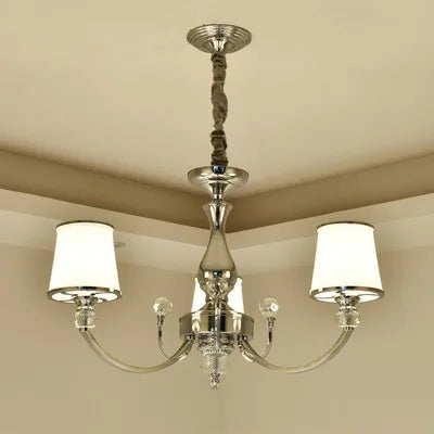 Baroque crystal chandelier with polished frame, two arms, white shades, and rope-wrapped stem.