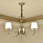 Baroque crystal chandelier with polished frame, two arms, white shades, and rope-wrapped stem.