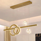 Geometric modern crystal chandelier with three spherical lights suspended by thin wires; elegant style.