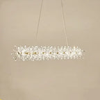 Modern crystal chandelier with LED rings, faceted crystals, and slim wires; dimmable elegant lighting.