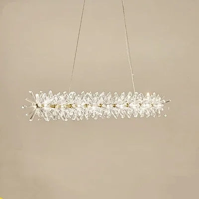 Modern crystal chandelier with LED rings, faceted crystals, and slim wires; dimmable elegant lighting.