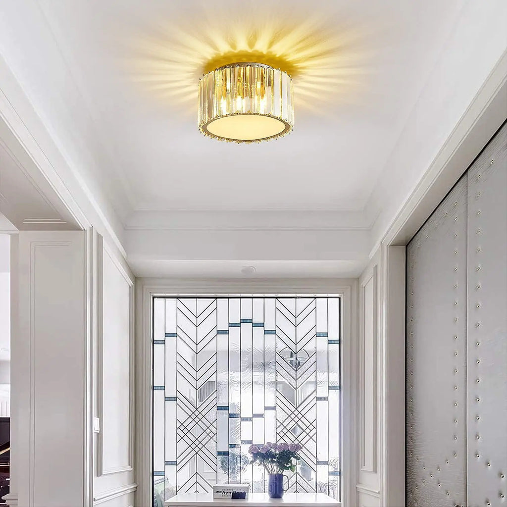 Maison Ornate Luxurious Round Crystal LED chandelier sparkles, creating radiant ceiling patterns above.