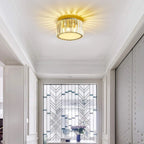 Maison Ornate Luxurious Round Crystal LED chandelier sparkles, creating radiant ceiling patterns above.