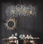 Maison Ornate Modern Crystal Dining Room Chandelier with chrome rounded branches, glowing overhead elegantly.