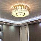 Maison Ornate Dimmable LED Crystal Glass Chandelier Round emits warm decorative patterns elegantly.