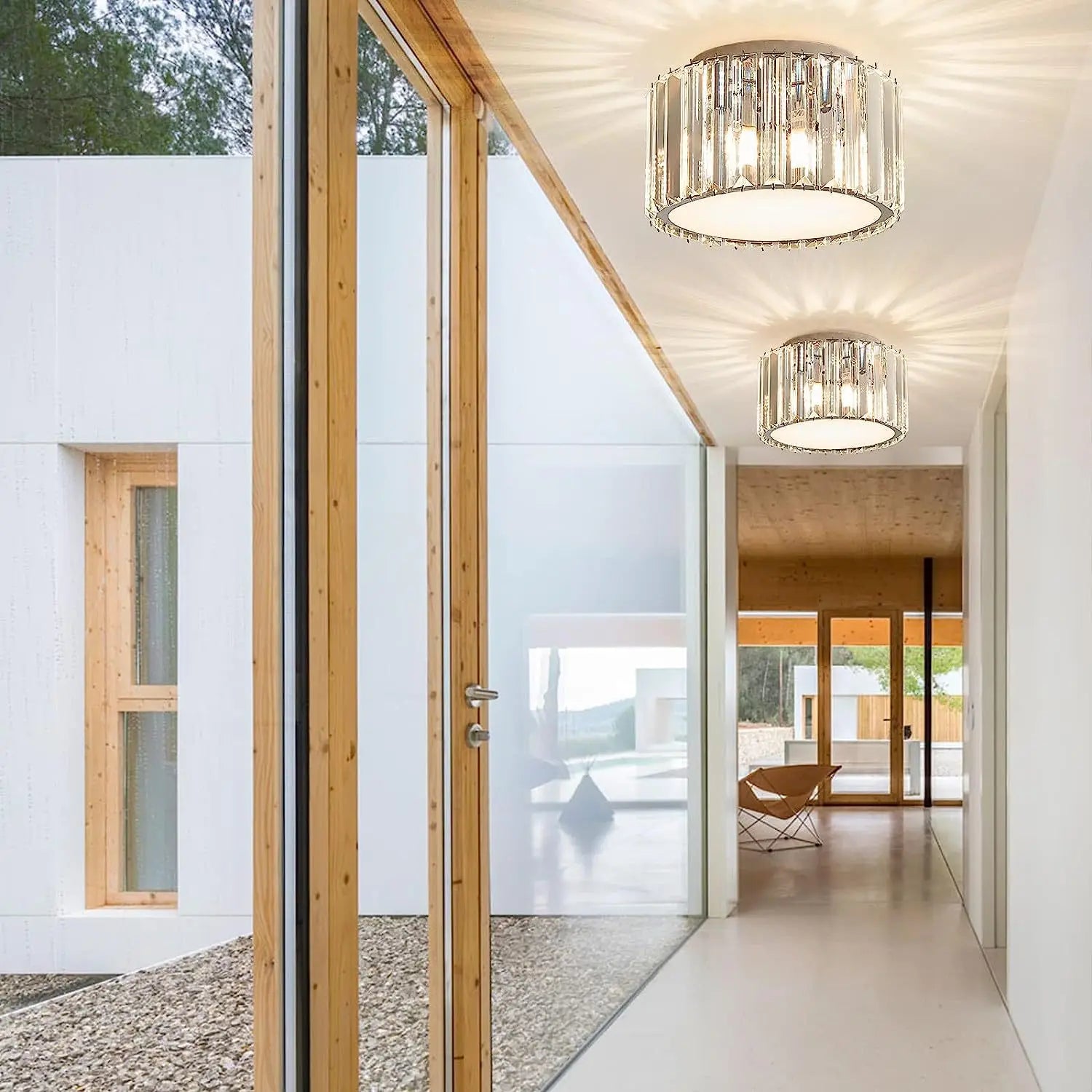 Two Maison Ornate Luxurious Round Crystal Hallway LED chandeliers with elegant, intricate crystal detailing.
