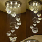 Modern crystal ball chandelier with stainless steel mount, multi-length drops, and sparkling LED lighting.