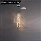 Modern chrome chandelier with textured rectangular shape, K9 crystals, LED lighting, and adjustable cord.