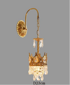 Gold sconce chandelier with ornate details, hanging crystals, crown design, and chain. Diameter: 23 cm.