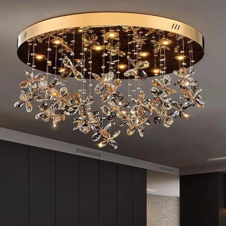 Gold and black circular chandelier with floral crystal accents, warm LEDs, modern style.