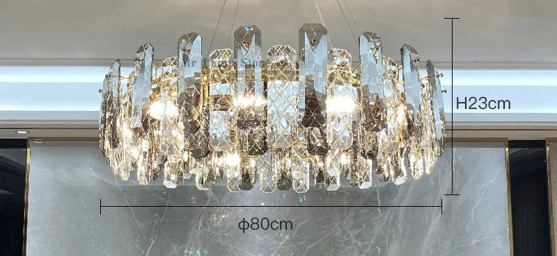 Oval crystal chandelier with LED lights, 23 cm high and 80 cm diameter, emits bright illumination.